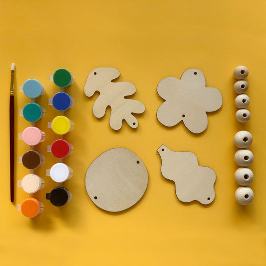 Mobile DIY kit with forest shapes and paint set